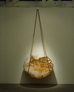  Bernoulli's Lid, 1996, rust-stained canvas, wood, rope, hook, 42 1/2