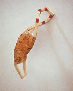 Curloop, 2003, rust-stained plastic, elecrical tape and wood, 8 