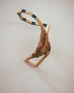 Cinch Lock, 2003, rust-stained plastic, electrical tape and wood, 6